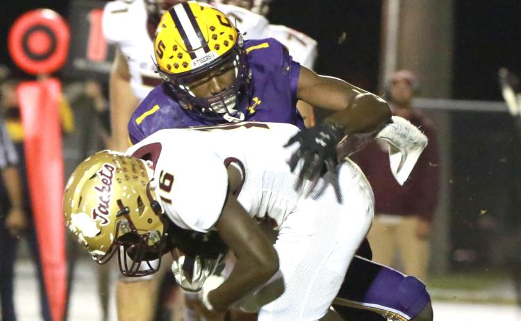 Columbia’s Shyheim Brown tackles St. Augustine running back Ty Baxter during Friday’s Region 1-6A final. (JEN CHASTEEN/Special to the Reporter)