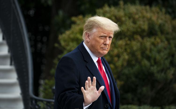 U.S. President Donald Trump waves as he departs on the South Lawn of the White House, on Dec. 12 in Washington, D.C. (AL DRAGO/Getty Images/TNS)
