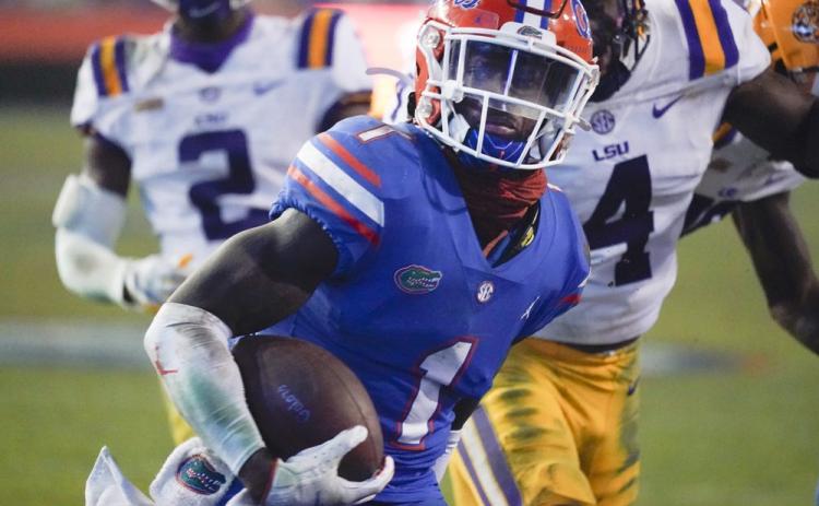 Florida wide receiver Kadarius Toney (1) scores a touchdown against LSU on Saturday in Gainesville. (JOHN RAOUX/Associated Press)