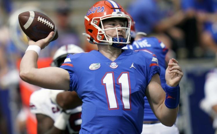 Florida quarterback Kyle Trask (11) throws a pass against South Carolina on Oct. 3 in Gainesville. (AP FILE PHOTO)