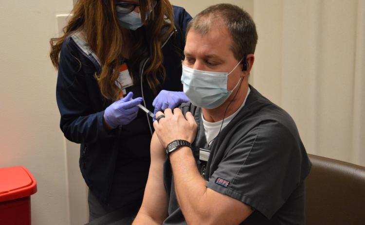 Brian Sellers was the first employee at Lake City Medical Center to receive the covid-19 vaccine on Monday. Sellers works in the emergency room at the hospital, which started vaccinating employees Monday with the Moderna vaccine. (COURTESY)