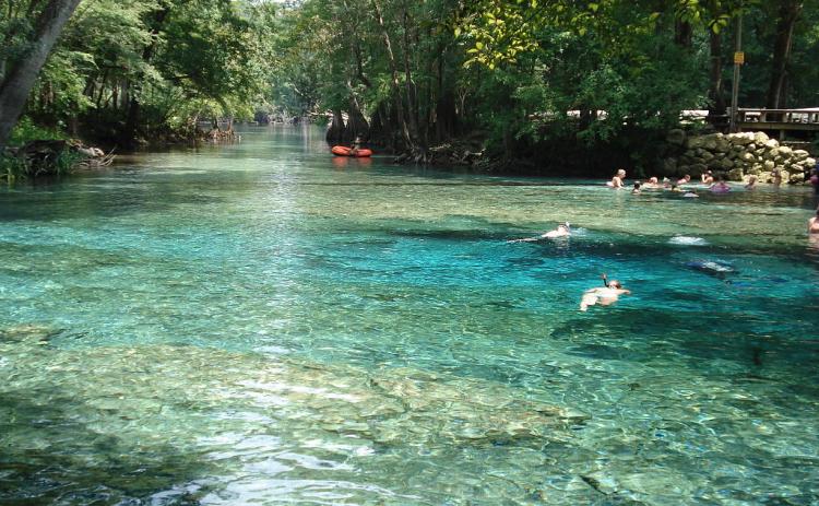 People enjoy a day in Ginnie Springs, which is also home to a Nestlé water-bottling plant, which is seeking a renewal of its permit to draw water from the springs. (FILE)