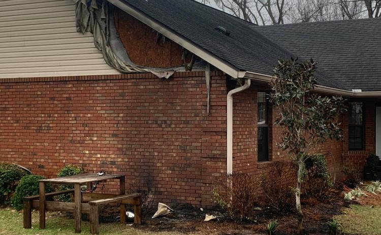 A home off 152nd Street in western Suwannee County sustained minor damage Wednesday after a heat lamp sparked a fire outside the house. (COURTESY SUWANNEE FIRE RESCUE)