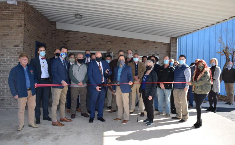 Lawrence Barrett, Florida Gateway College president, prepares to cut the ribbon Thursday afternoon at the grand opening of the college’s new multipurpose building in the former Boys Club of Columbia County facility. Joining Barrett were FGC officials, Florida Chancellor of Career Technical Programs Henry Mack and local dignitaries and residents. (COURTESY FLORIDA GATEWAY COLLEGE)