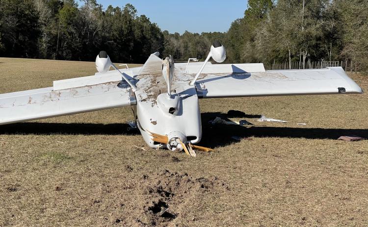 A small airplane flipped over on a grass airstrip in O’Brien on Friday afternoon after its front wheel broke after landing. (COURTESY SUWANNEE COUNTY SHERIFF'S OFFICE)