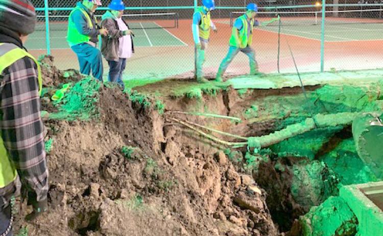 Lake City utility crews worked late into the night Tuesday fixing a water main break at Columbia High School. (COURTESY)
