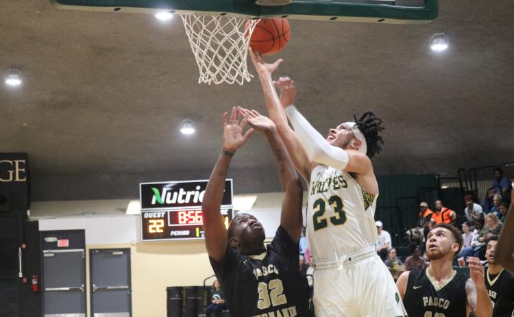 Florida Gateway College forward Brandon Farmer rises to score against Pasco-Hernando State College during last season’s Division II Region 8 Championship. (JORDAN KROEGER/Lake City Reporter)