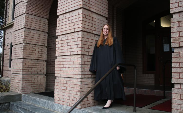 Sara Carter, stands on the steps of the Columbia County Courthouse on Friday afternoon. Carter, 42, has been serving as the Columbia County Court judge for roughly two weeks. (TONY BRITT/Lake City Reporter)