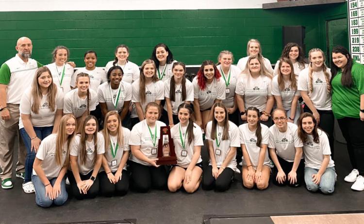 Suwannee’s girls weightlifting team poses with the Region 1-1A trophy on Friday. (COURTESY)