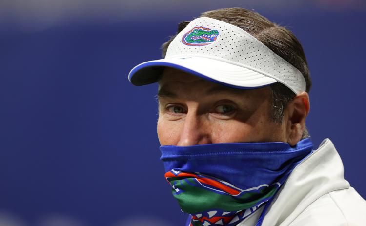 Florida Gators head coach Dan Mullen walks on the field during pregame warmups prior to facing the Alabama Crimson Tide in the SEC championship game at Mercedes-Benz Stadium on Dec. 19, 2020, in Atlanta, Ga. (KEVIN C. COX/Getty Images/TNS)