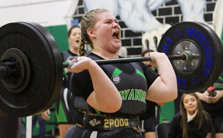 Suwannee lifter Autum Latreille performs the clean and jerk during Friday’s District 4-1A meet. Latreille was one of nine SHS lifters to win weight classes as the Lady Bulldogs won their third straight district title. (PAUL BUCHANAN/Special to the Reporter)
