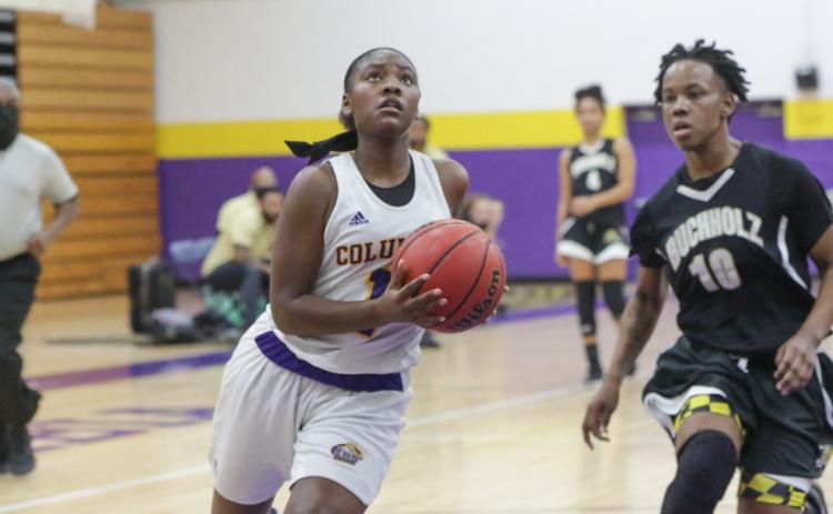 Columbia guard Anzarria Jerkins goes up for a shot against Buchholz during the District 2-6A championship game on Feb. 5. (BRENT KUYKENDALL/Lake City Reporter)