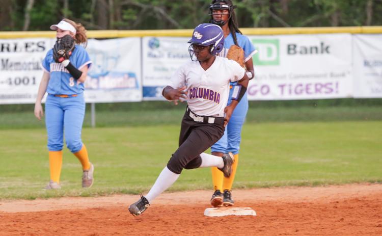 Columbia’s Zoryanna Hughes rounds second base to head towards third in a game against Chiefland last season. (FILE)