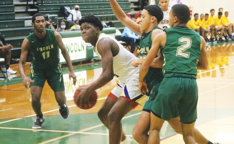 Columbia forward Marcus Peterson looks to shoot against Lincoln during the District 2-6A championship on Feb. 12. (JORDAN KROEGER/Lake City Reporter)