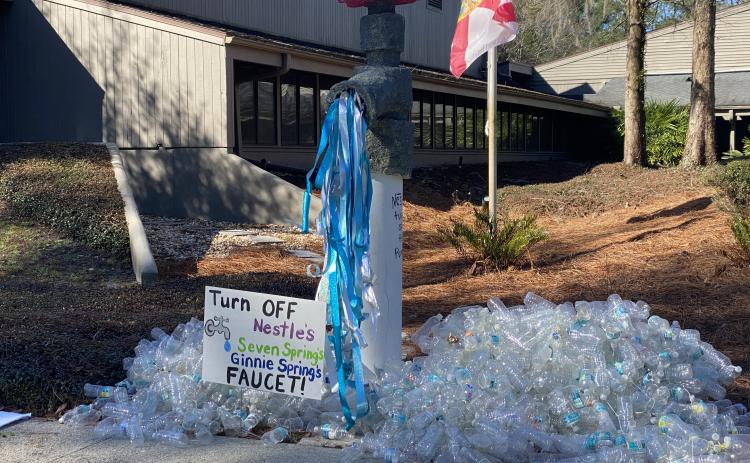 A demonstration set up by protesters Tuesday morning at the Suwannee River Water Management District headquarters against Seven Springs Company’s request for a permit renewal to withdraw nearly one million gallons a water a day from Ginnie Springs. (COURTESY)