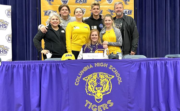 Columbia catcher and golfer Reece Chasteen (bottom middle) signed her letter of intent with Emory and Henry College on Monday to play both softball and golf. Chasteen is pictured with her mother Jen (from left), brother Milla, sister Kaicie, brother Moss, sister Emy and father Matt. (COURTESY)