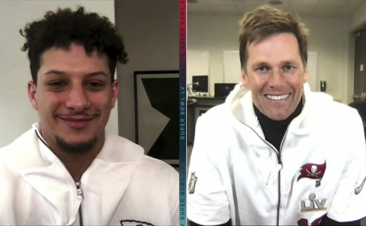 In this still image from video provided by the NFL, Kansas City Chiefs quarterback Patrick Mahomes, left, and Tampa Bay Buccaneers quarterback Tom Brady speak during Opening Night for Super Bowl 55 on Monday. (NFL)
