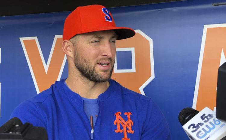 Syracuse Mets' Tim Tebow speaks with reporters prior to a minor league baseball game on may 16, 2019, in Syracuse, N.Y. Tebow had been invited to big league spring training by the New York Mets, taking one of 75 spots after Major League Baseball limited spring roster sizes as a coronavirus precaution. (AP FILE PHOTO)