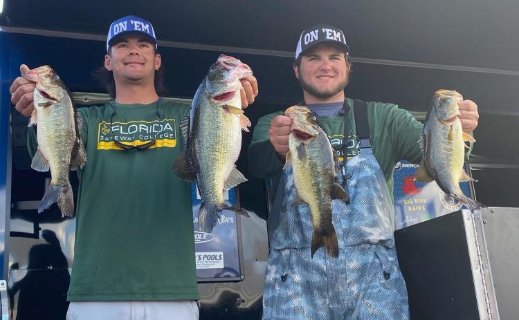 FGC’s Seth Slanker (left) and Jackson Swisher (right) pose with their winning fish at the Florida Bass Nation Bassmaster College Series qualifier on Lake Okeechobee on Saturday. (COURTESY)