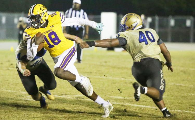 Columbia receiver Marcus Peterson fights through a Daytona Beach Mainland tackler during a Region 1-6A playoff last season. (FILE)