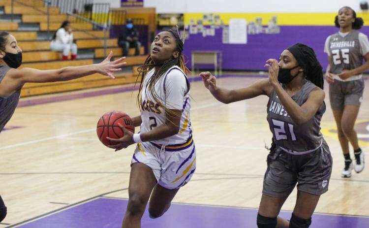 Columbia guard Na'Haviya Paxton drives to the basket to score against Gainesville during the District 2-6A semifinals on Feb. 3. (BRENT KUYKENDALL/Lake City Reporter)