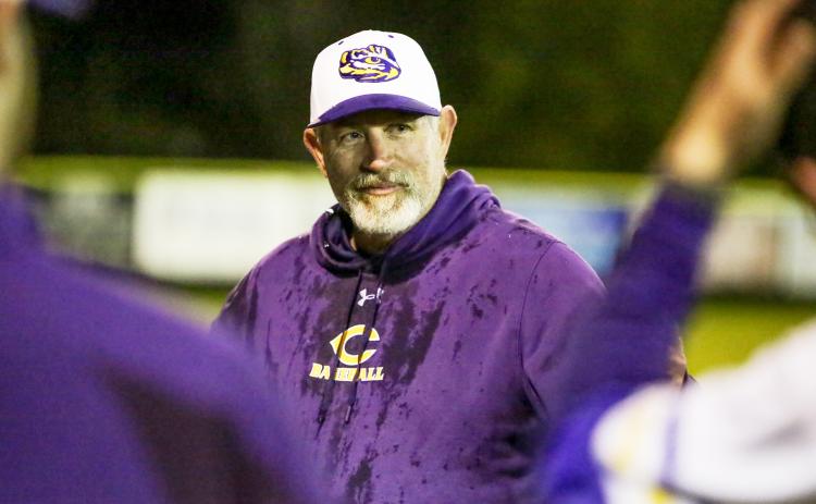 Columbia coach Brian Thomas smiles after receiving an ice-water bath from his team following the Tigers’ 13-1 win over Bradford on Wednesday night, which gave Thomas 300 victories in his career. (BRENT KUYKENDALL/Lake City Reporter)