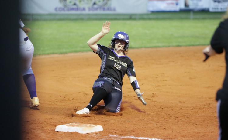 Columbia right fielder Caitlyn O’Sullivan slides safely into third base against Bell on Tuesday night. (BRENT KUYKENDALL/Lake City Reporter)