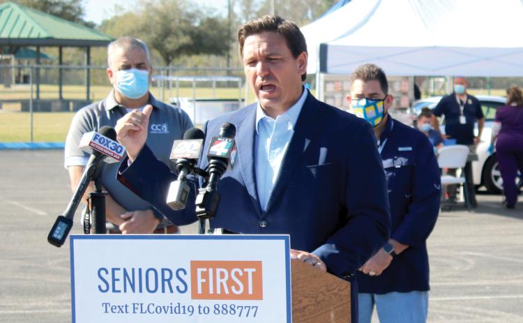 Gov. Ron DeSantis speaks to the media during a Thursday morning press conference at Southside Sports Complex, where he gave an update regarding the state’s covid vaccine effort. (TONY BRITT/Lake City Reporter)