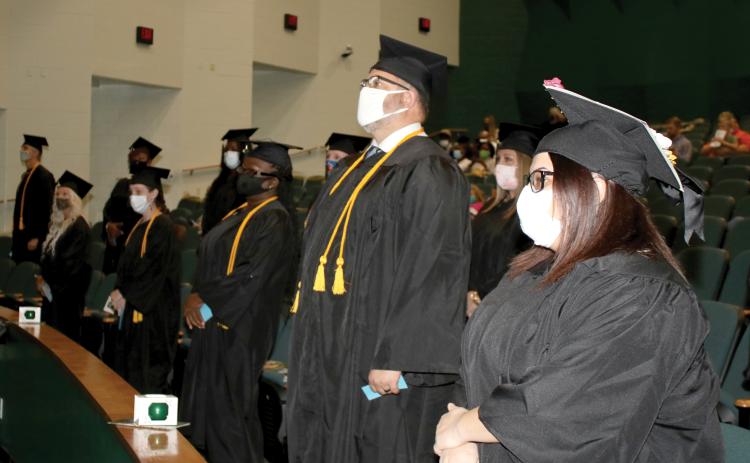 Florida Gateway College graduates await the start of their commencement ceremony in December. The college is continuing to hold small group graduation exercises this spring. (FILE)