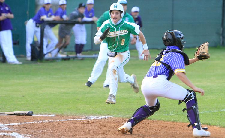 Suwannee’s Tyson Greene beats out a throw at home plate to score a run as Columbia catcher Grant Bowers gets set to catch the ball Tuesday night. (PAUL BUCHANAN/Special to the Reporter)
