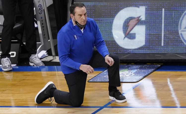 Duke head coach Mike Krzyzewski watches the action during the second half of a game against Louisville in the second round of the Atlantic Coast Conference tournament on Wednesday in Greensboro, N.C. (GERRY BROOME/Associated Press)