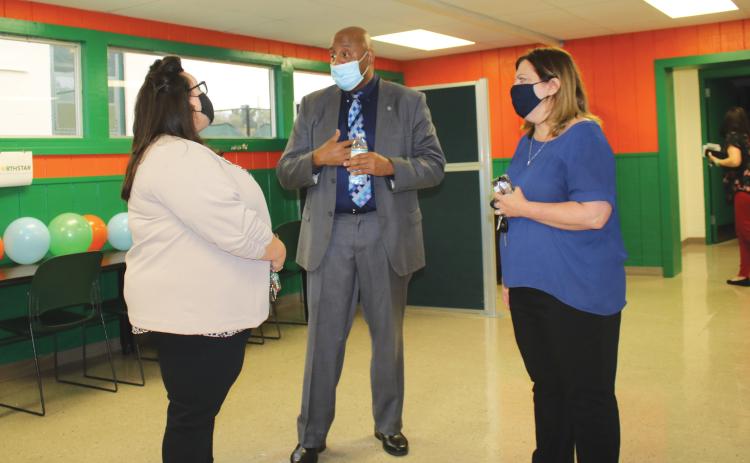 NorthStar Family Resource Center manager Philip Mobley (center) gives a tour of the facilities at the Richardson Community Center.