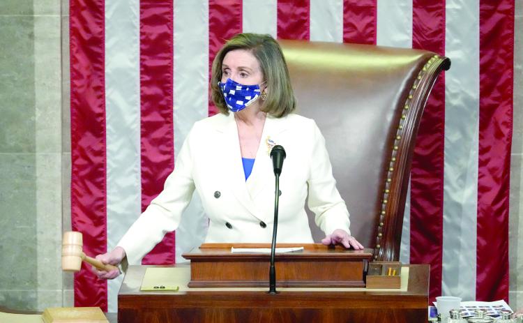 Speaker of the House Nancy Pelosi, D- Calif., raps her gavel after the House voted to pass the American Rescue Plan on Wednesday in Washington, D.C. (DREW ANGERER/Getty Images/TNS)