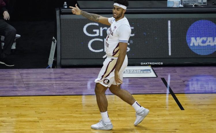 Florida State guard Anthony Polite (2) celebrates a 3-pointer against Colorado during a second-round game in the NCAA Tournament at Farmers Coliseum on March 22 in Indianapolis. (CHARLES REX ARBOGAST/Associated Press)