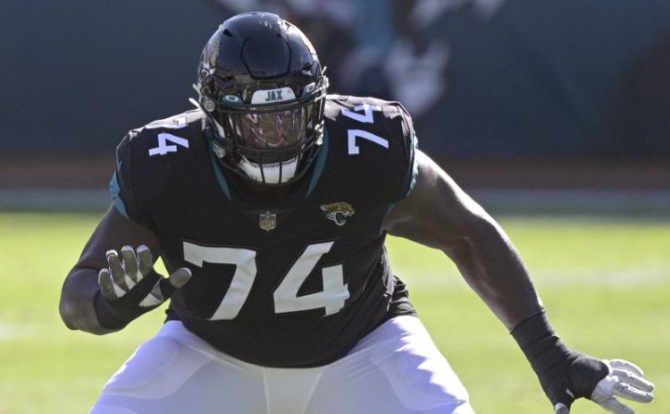 Jacksonville Jaguars offensive tackle Cam Robinson (74) sets up to block against the Chicago Bears on Dec. 27, 2020, in Jacksonville. The Jaguars are planning to use the franchise tag on left tackle Cam Robinson, preventing him from hitting the free-agent market and making him the blindside protector for presumptive No. 1 draft pick Trevor Lawrence. Coach Urban Meyer said Tuesday that “we are headed in that direction.” (AP FILE PHOTO)