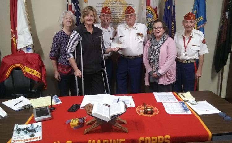 The Tri-County Veterans Fund raised more than $37,000 from donations at the Suwannee Lights’ military display at the Spirit of the Suwannee Music Park. SOSMP General Manager Teena Peavey presented the group with a check for $37,539.51 last month. Pictured are Pat Walsh, from left, Peavey, Russ Carson, Jim Kennedy, Jenny Parcels and Charles Tedesco. (COURTESY)