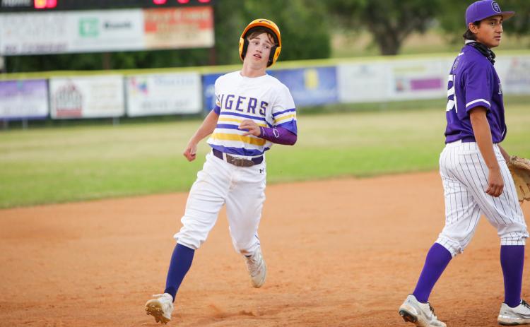 Columbia pitcher Matthew Dumas walks off the field after getting stranded at second base in the third inning of Tuesday’s game against Gainesville. (BRENT KUYKENDALL/Lake City Reporter)