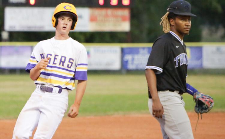 Columbia outfielder Branson Mann advances to third base on a passed ball against Trinity Christian on Friday night. (BRENT KUYKENDALL/Lake City Reporter)