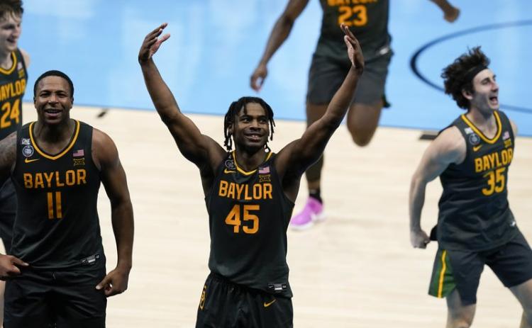 Baylor guard Davion Mitchell (45) celebrates at the end of the championship game against Gonzaga in the men's Final Four in the NCAA Tournament at Lucas Oil Stadium on Monday in Indianapolis. Baylor won 86-70. (DARRON CUMMINGS/Associated Press)