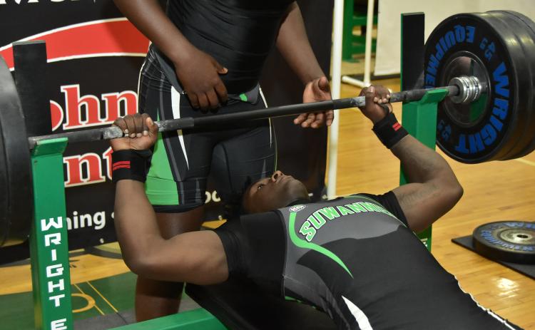 Suwannee’s Jaquez Moore performs the bench press during Thursday’s District 3-2A Meet. (ROB WOLFE/Special to the Reporter)