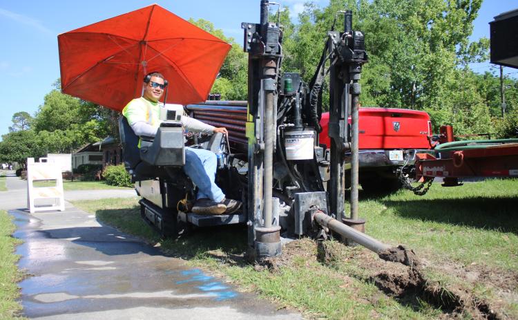 Carlos Mendez uses a JT 20 Ditchwitch directional boring drill while instilling pipe that will house fiber-optic cable. Hargray Fiber is building a totally fiber-based network in Lake City to provide high speed internet, business telephone services and cable television. (TONY BRITT/Lake City Reporter)