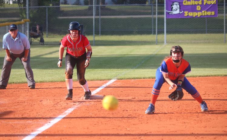 Fort White pitcher Hannah LeBleu takes a lead off of third base as a pitch flies by during Tuesday night’s District 6-1A semifinal against Taylor County. (JORDAN KROEGER/Lake City Reporter)