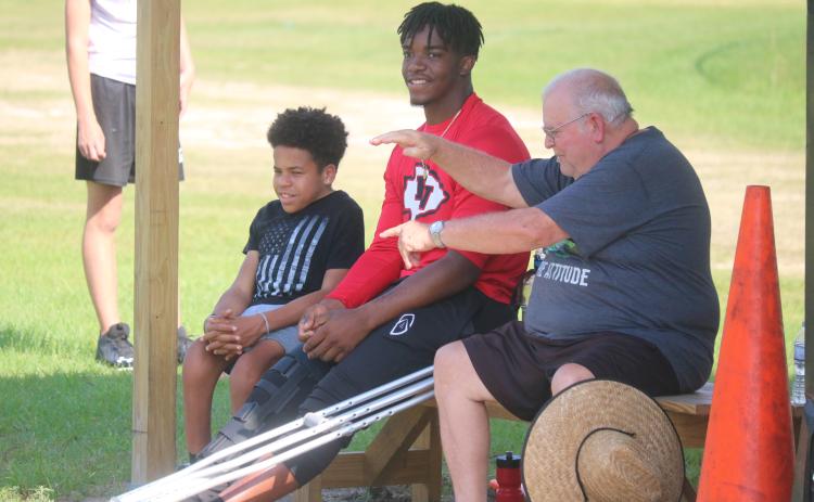 Fort White quarterback Tyler Jefferson watches practice from the sideline on Wednesday. Jefferson is out for all of spring practice after having knee surgery about six weeks ago. (JORDAN KROEGER/Lake City Reporter)