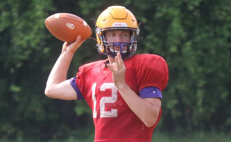 Columbia quarterback Kade Jackson throws a pass during Friday's practice. (JORDAN KROEGER/Lake City Reporter)