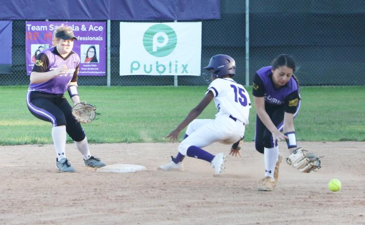 Columbia second baseman Sofia Arata can’t hold onto a throw as Gainesville’s Jayla Clark slides safely into second base. (MORGAN MCMULLEN/Lake City Reporter)