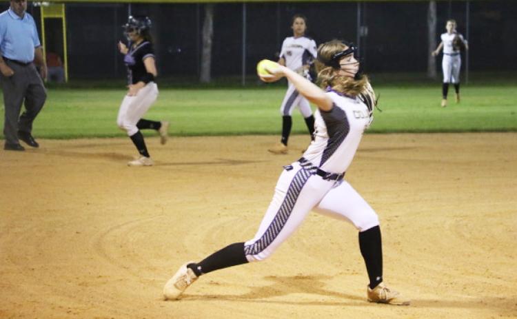 Columbia pitcher Emma Edson fires to first base for an out against Gainesville during the District 3-5A semifinals on Tuesday night. (MORGAN MCMULLEN/Lake City Reporter)