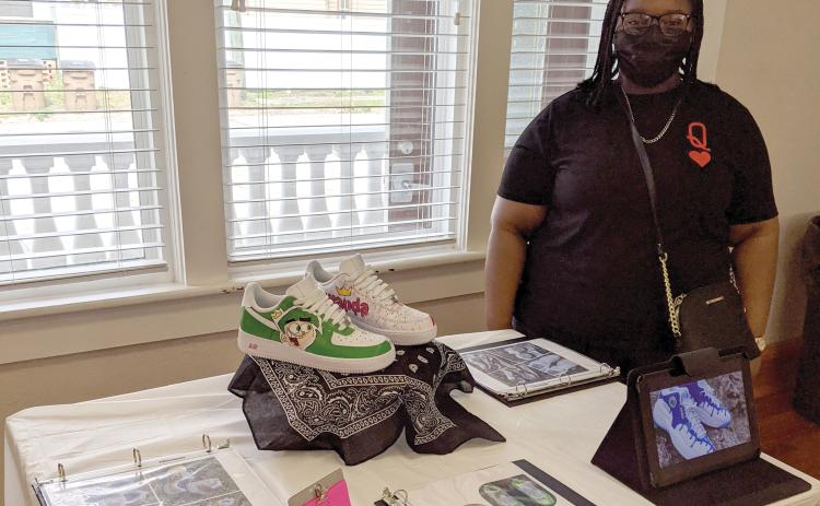 Columbia High junior Marchela Stroud shows off a pair of custom shoes she makes through her business, ‘Your Idea My Creation.’ (COURTESY)