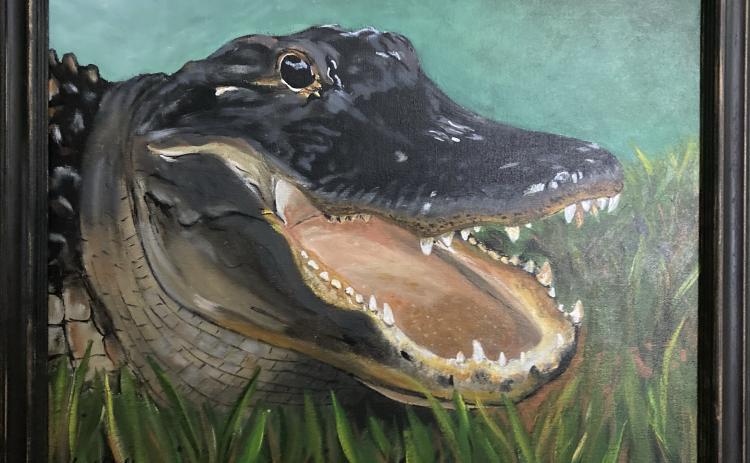 A framed painting of an alligator painted by Lara Wehrli during her six-week hiatus from her job as a dental hygienist will be part of an exhibit at Gateway Art Gallery starting Friday. (COURTESY)