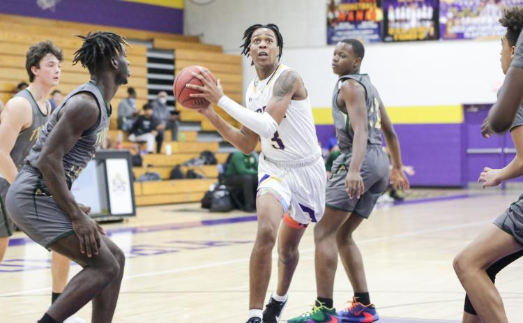 Columbia forward Charleston Ponds drives to the basket against Trinity Catholic this past season. (BRENT KUYKENDALL/Lake City Reporter)