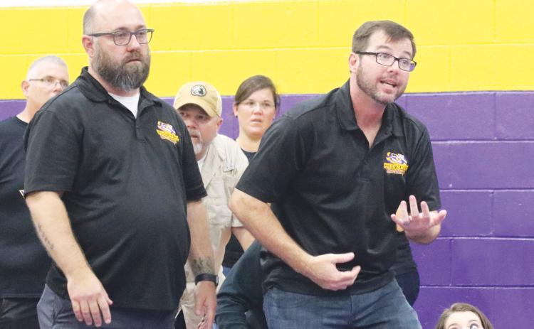 Columbia wrestling coach Pete Whittington (right) yells out instructions to a wrestler during the Tiger Duals in 2020. (JORDAN KROEGER/Lake City Reporter)